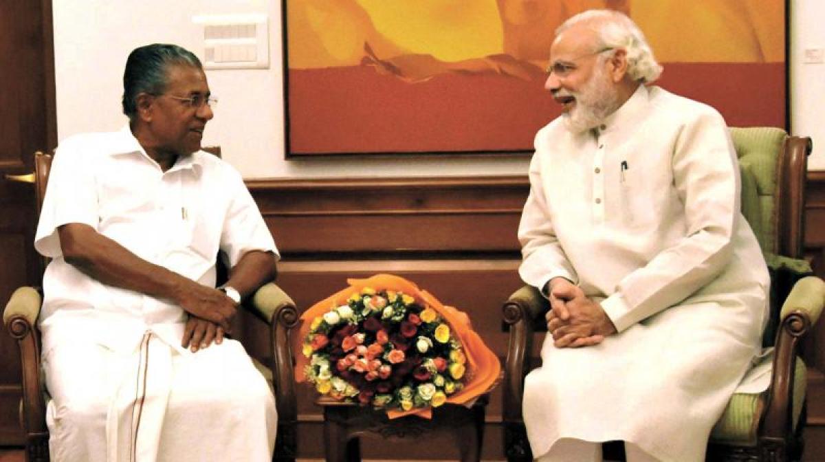 PM Modi raises issue of Poll violence in Kerala with CM Vijayan